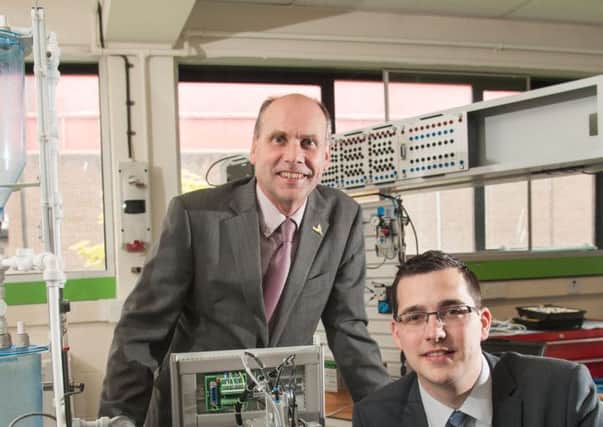 Dr. Brian Hill MBE, Head of School for Engineering & Science pictured with Mark Maginty who came 10th place in the 2011 London Mechatronics WorldSkills competition.  Mark is now an Engineering Lecturing at NRC.