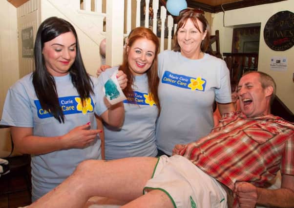 Declan Scullion feeling the pain for charity in a sponsored wax in the Ceili House Bar in aid of Marie Curie Cancer Care with Alannah Burns, Kelly Forbes and Bernie McGrath INTT2314-610OC