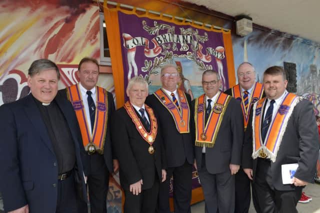The platform party at the unfurling and dedication of a new banner for Britannia L.O.L. 1912 on Saturday, from left, Dean William Morton, Robin Logan, Deputy Master, Britannia L.O.L. 1912, James Hetherington, City Grand Master, City of Londonderry Grand Orange Lodge, Raymond Spiers, District Master, East Belfast District No.6, Victor Wray, Past City Grand Master, Mervyn Gibson, Grand Chaplain, Grand Orange Lodge of Ireland, and Peter Ross, Lay Chaplain, City of Londonderry District No.4. INLS2214-205KM