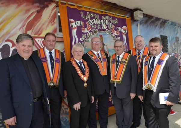 The platform party at the unfurling and dedication of a new banner for Britannia L.O.L. 1912 on Saturday, from left, Dean William Morton, Robin Logan, Deputy Master, Britannia L.O.L. 1912, James Hetherington, City Grand Master, City of Londonderry Grand Orange Lodge, Raymond Spiers, District Master, East Belfast District No.6, Victor Wray, Past City Grand Master, Mervyn Gibson, Grand Chaplain, Grand Orange Lodge of Ireland, and Peter Ross, Lay Chaplain, City of Londonderry District No.4. INLS2214-205KM