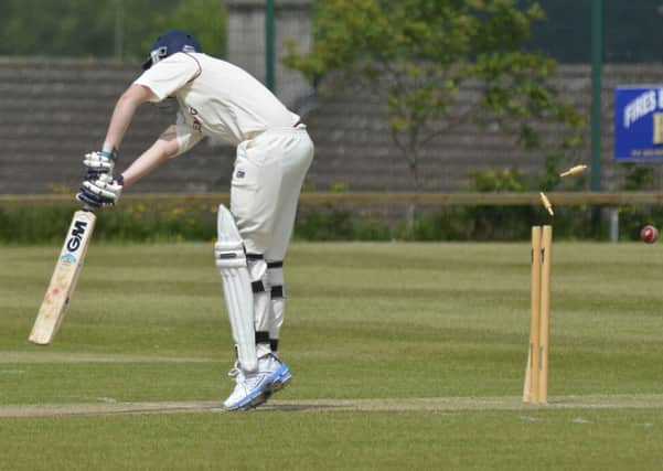 The bails flys as Bready second's batsman Matty Barr is bowled out during their match against Strabane 2nd's on Saturday. INLS2214-119KM