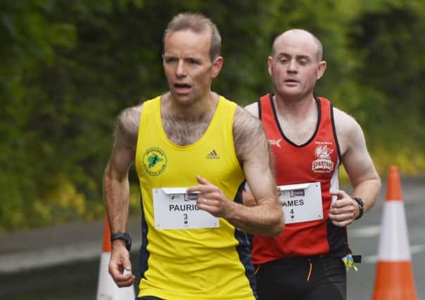 Pauric McKinney and James Crampsey pictured on their way to placing 2nd and 3rd in Sunday's Walled City Marathon. INLS2214-138KM