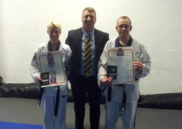 Rodney Moody and Kathy Brennan are pictured with Ballymoney Ju-Jitsu Club coach, Sensei Peter Kernohan, 3rd Dan.