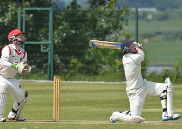 Bready 2nd's batsman Ross Dougherty can only watch as this shot sails high, and into the hands of a Strabane second's fielder. INLS2214-122KM