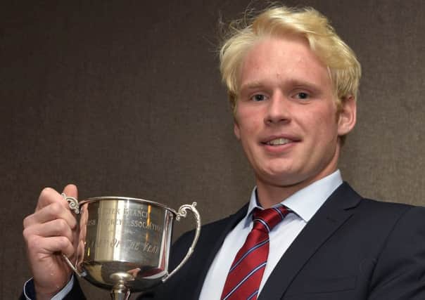 Phillip Brown with his Ulster Men's Player of the Year Trophy. Pic: Rowland White/PressEye