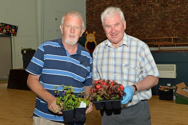 Bill Pollock (right) chair of Brighter Whitehead and David Brown, treasurer, pictured at the plant sale in Whitehead Community Centre. INCT 23-006-PSB
