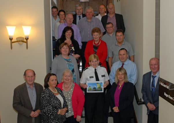 Manager of the Policing and Community Safety Partnerships committee, Wendy Carson (front 2nd right) is pictured with PSNI, elected and independent members at their meeting in the Town Hall. INLT 23-005-PSB