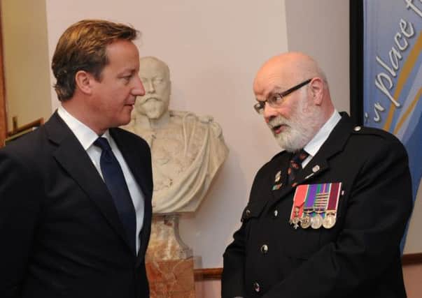 Prime Minister David Cameron meeting Davy Boyle M. B.E., The Caring Caretaker at Coleraine Town Hall.  Photo M  T Hurson/Harrisons