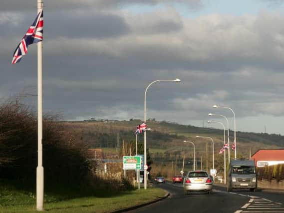 (file pic) Flags on the approach to Whitehead.