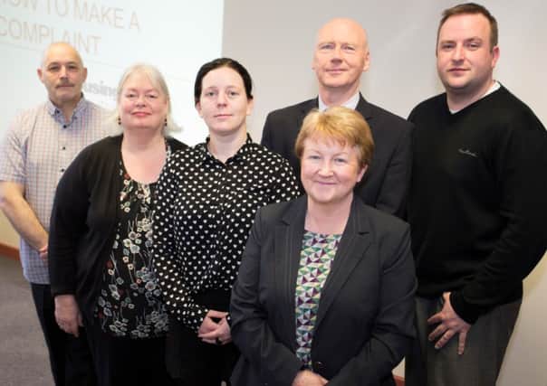 The East Tenant Scrutiny Panel with the Housing Executives Area Manager,  Mairead Myles Davey (front) and Eric Woods, Housing Services Manager.  INCT 24-723-CON