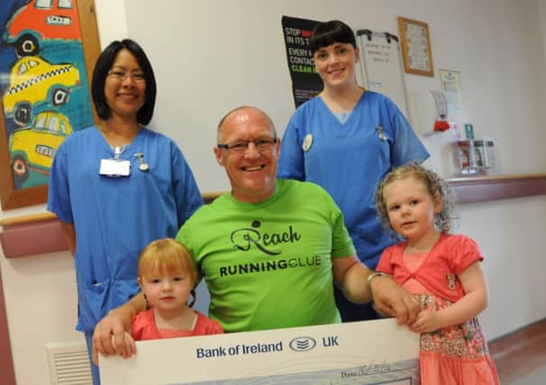 Pictured accepting the cheque from Freya, Gary and Aya Seymour are: Janet L Aquitania, Western Trust Staff Nurse and Nicola Martin, Western Trust Staff Nurse.