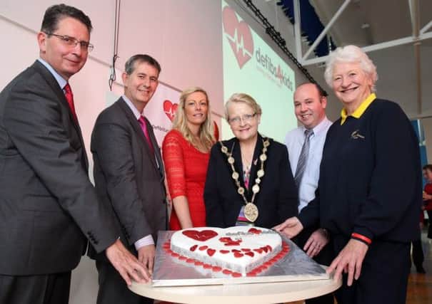 Gerry McVeigh, principal at St Coleman's PS, Health Minister Edwin Poots, Stephanie Leckey from the British Heart Foundation, Mayor Margaret Tolerton, St Coleman's teacher Art Kernan and Dame Mary Peters at the launch of a project to map the locations of defibrillators in Northern Ireland, and also to mark the first anniversary of the defibs4kids project, held at St Coleman's PS. US1423-570cd Picture: Cliff Donaldson
