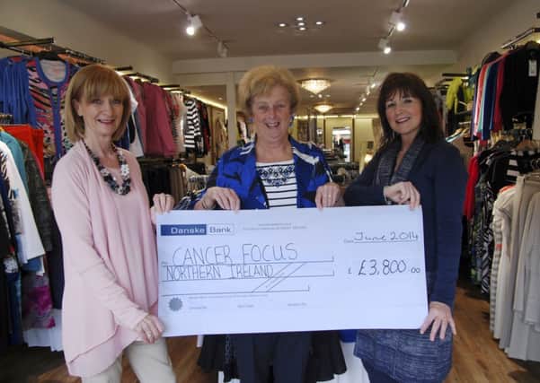 Libbis McAllister and Susan Lawson, of Ultimate in Fashion, present a cheque for £3,800 to Jean Kennedy, of Ballymena Cancer Focus Support Group, proceeds of Ultimate in Fashion's recent Ladies' Luncheon and fashion show at Tullyglass House House. As a result of a number of fund-raising events throughout the year, the Ballymena group has raised £15,330 for Cancer Focus NI.