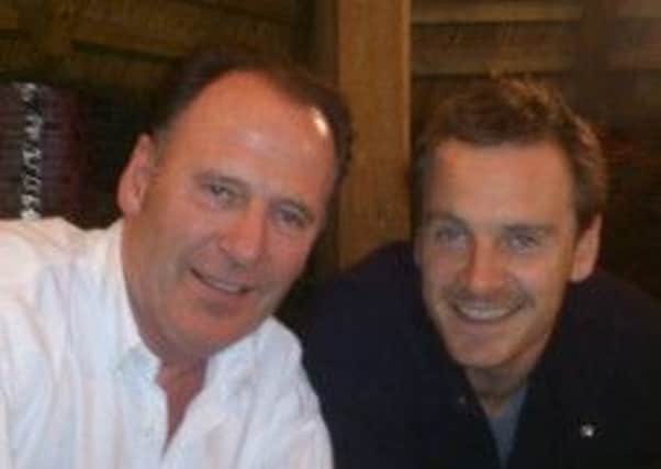 Larne man Mike Collins with his famous nephew, actor Michael Fassbender. INLT-23-714-con