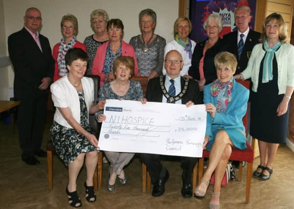 Murial Barr, Secretary of the Ballymena Hospice Support Group, is pictured receiving a cheque for £25,000 from Deputy Mayor of Ballymena, Cllr. Hubert Nicholl, a donation from the council to the NI Hospice. Included are Margaret Butler (Hon. Treasurer NI Hopsice), Hospice members and local councillors. INBT24-205AC