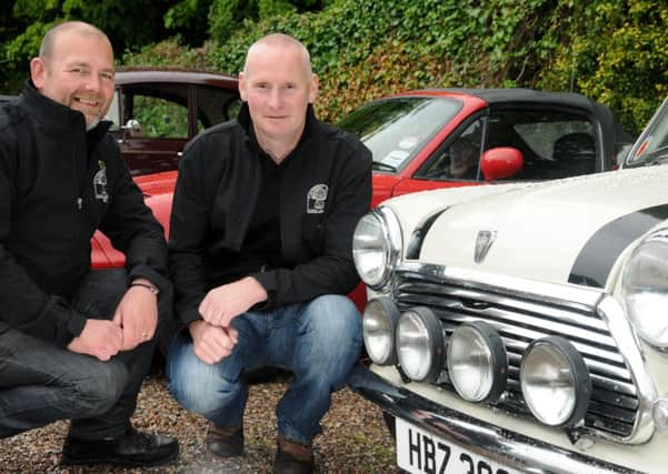 Paul Harkness and Brian Reid who took along their classic mini's to the Mid-Ulster Vintage Vehicles Club 38th Vintage Rally held in the grounds of Springhill last Saturday.INMM2414-373