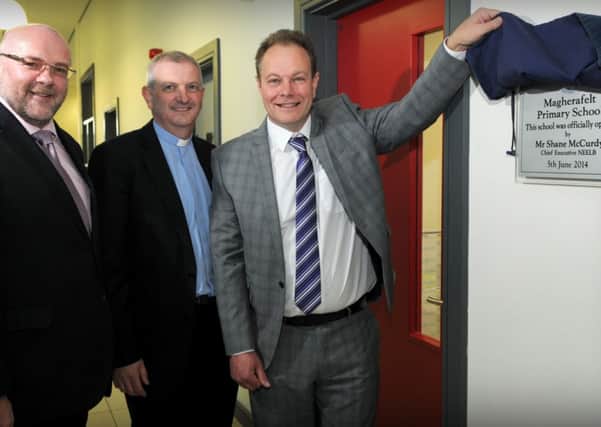 Shane McCurdy (Left) Chief Executive NEELB  who officially opened Magherafelt Primary School last Thursday afternoon with the help of Rev Jonathan Curry (Chair of the Board of Governors) and George Buckley (Principal).INMM2414-325