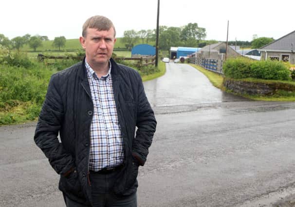 Kevin McAuley Photography Multimedia- Mervyn Storey MLA at the scene at Ballinaloob Road near Dunloy Co Antrim where a 51 year old man and an 8 year old child have been involved in an accident involving a slurry tank.. Pic Steven McAuley