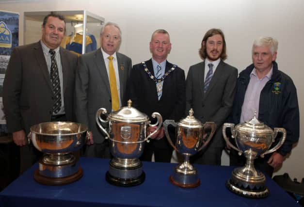 CUP ALOAD OF THAT. Pictured at the opening of the GAA Exhibition in Ballymoney Museum along with Deputy Mayor Cllr Ian Stevenson and Daniel Taylor (Museum Officer) who organised the event are Jim Murray, Antrim County Chairman, Martin McAviney, Ulster GAA President and Jim McLean, North Antrim Chairman.INBM24-14 002SC.