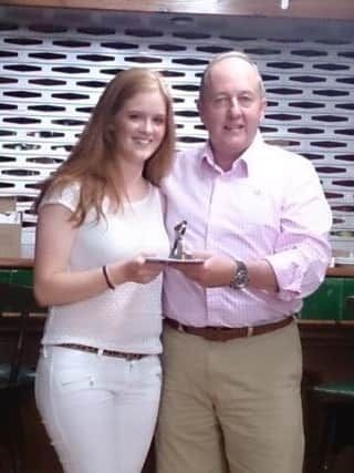 Sarah Boyles receives the Best Back and Players' Player of the Year award from Norman Blair. (s)