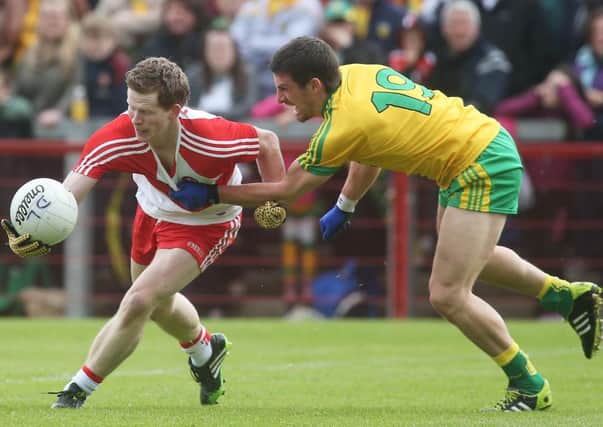 Derry's Enda Lynn and Donegal's Paddy McGrath.