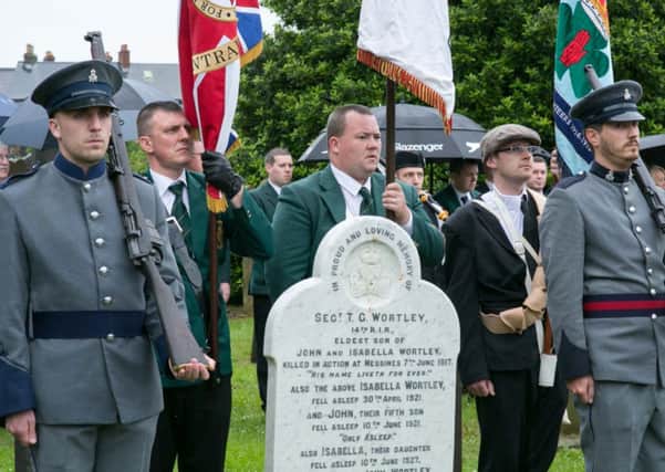 The colour party at Sgt Wortley's grave. INCT 24-407-RM