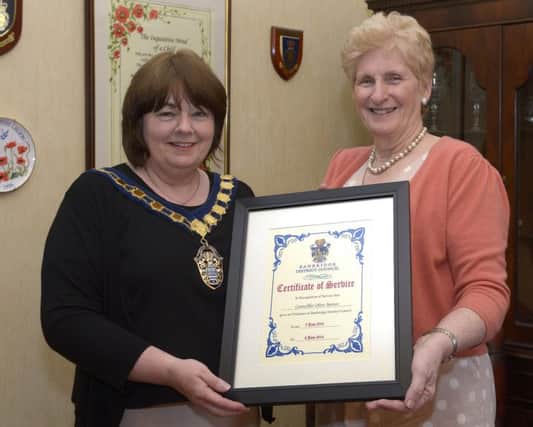 Cllr Marie Hamilton, the new Chair of Banbridge District Council, presented outgoing Chairman Cllr Olive Mercer with a Certificate of Service in recognition of the service given during her year in office © Edward Byrne Photography INBL1423-252EB