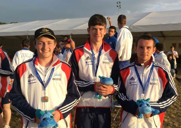 Archery GB's Jordan Mitchell, Jon Bull and Jake Burn celebrate their compound junior men's silver win. INLT 24-940-CON