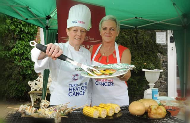 Merlyn Love of Hanover House Coagh alongside Ethna Gallagher as they officially launch the Cancer Research UK "Big Grill" were the charity invites people to have a barbaque during the month of July to raise funds for the Cancer charity.INMM2414-388