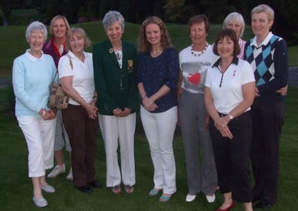 Lisburn Golf Club Lady Captain Gil Colvin with Deirdre Burns from Forest Feast and some of the prize winners at the  Forest Feast Lisburn Ladies Open.