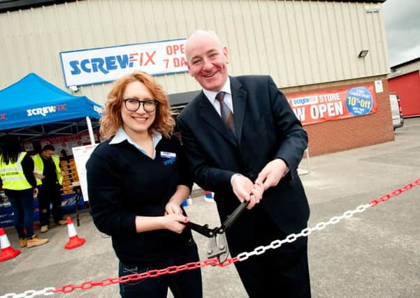 Mark Durkan, MP for Foyle, and Magdalen Magill, store manager, launch the new shop for Londonderry