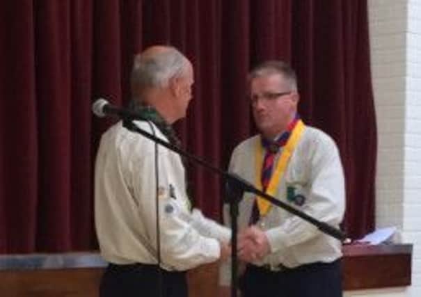 Noel receiving his award from John Logan, County Scout Commissioner for County Antrim.