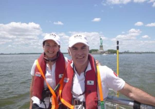 Samantha Tosh and Richard Greer on board CV24 Switzerland going past the Statue of Liberty at the start of Race 14.