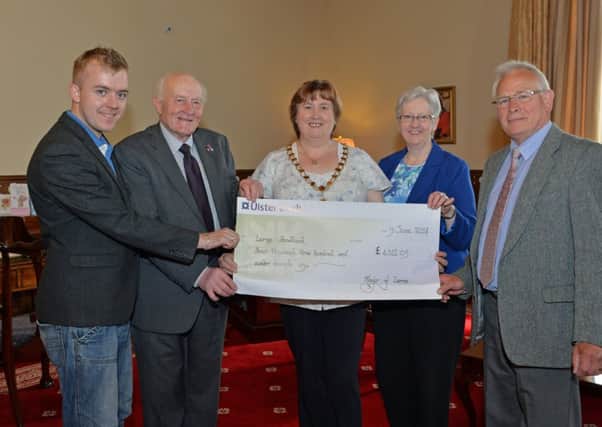 Mayor of Larne Maureen Morrow along with Alderman Roy Beggs and Councillor Mark McKinty present a cheque gfor £4,311.09 Elaine Barrett, voluteer coordinator with Larne Food Bank and Alex Munro, Chair of Larne Food Bank, the money was raised by donations at the Mayor`s Ball and the Larne Sports Awards. INLT 24-028-PSB