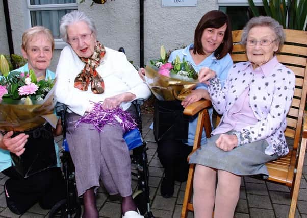 100 year old Peggy Doak with Team Leader Liz Lavery and 104 year old Doris McCleery with team leader Delia Foy of Kingsway Nursing Home US2414-404PM Pic by Paul Murphy