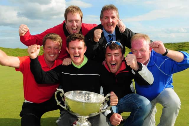John-Ross Galbraith celebrates with fellow Whitehead Golf Club members (from left) Colin Farr (Club Professional), Darren Kane, Jeremy Jones, Chiz Parker and Terry Kane after his victory at the 2014 AIG sponsored Irish Amateur Close Golf Championship at Seapoint Golf Club. Picture: Pat Cashman