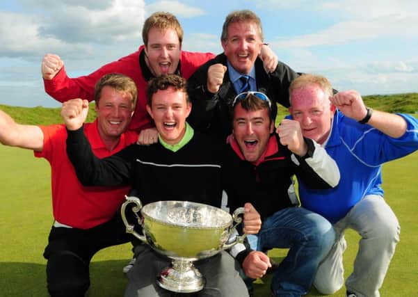 John-Ross Galbraith celebrates with fellow Whitehead Golf Club members (from left) Colin Farr (Club Professional), Darren Kane, Jeremy Jones, Chiz Parker and Terry Kane after his victory at the 2014 AIG sponsored Irish Amateur Close Golf Championship at Seapoint Golf Club. Picture: Pat Cashman
