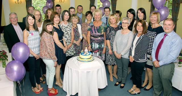Cutting her retirement cake after 33 years service at Ballymena Nursery was Belinda Wilson photographed on Friday night with staff and special guests at her retirement dinner. INBT 23-855H