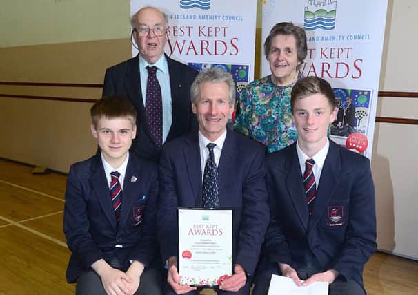 Larne Grammar School was awarded runner up in the post primary category, Northern Education and Library Board, at the 2014 Best Kept Schools Awards. 

Pictured (back row l-r) is NIAC board member Joe Murphy, and Doreen Muskett, Chair of the Amenity Council. 
(Front row) Year 11 pupils Nathan Hull and Sam Wood James Christie, Head of conservation at the school. INLT 25-680-CON