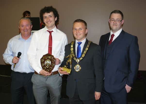 Mayor of Newtownabbey, Alderman Thomas Hogg, presents the Player of the Year award to Kyle Quinn pictured with Gerard Crossan (manager) and Robert McLaughlin (chairman). INLT 24-946-CON