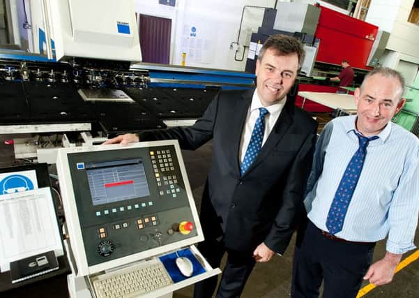 Invest NI visit  Garage Doors Systems Ltd, Ballymena.
Pictured are Alastair Hamilton, Invest NI and Peter Doherty, Managing Director of Garage Doors Systems Ltd