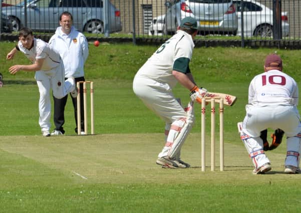 Chris Dempsey bowling for Larne in their game against Ards at Sandy Bay. INLT 25-001-PSB