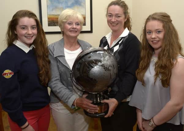 On behalf of the Russell family, Diana Whan presented the Ladies Endeavour Trophy, Inspired by the late Denise Russell, to winner Lorna Poots, included are Megan and Melissa Whan © Edward Byrne Photography INBL1424-208EB