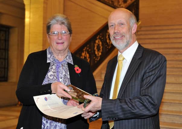 Gillian Corbett receiving her Award from Justice Minister David FordPicture: Michael Cooper