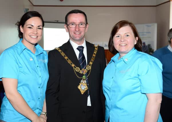 Pacemaker press 10/5/14  Dubheasa Gallagher and Mayor Cllr Duddy with Pamela frazer help out with Coleraines  new commitment to becoming a dementia freindly community. A launch was held in the town yesterday tuesday the 10th.  The event was launched by the mayor of Coleraine Cllr Duddy at the council chamber in Coleraine in partnership with the Alzheimer's Society and the Northern health and social care trust.   So far more than 30 businesses have signed up to become more dementia freindly. Picture Mark Marlow/pacemaker press