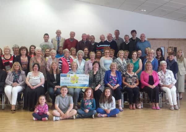 Members of Lurgan Musical Society show off their cheque.