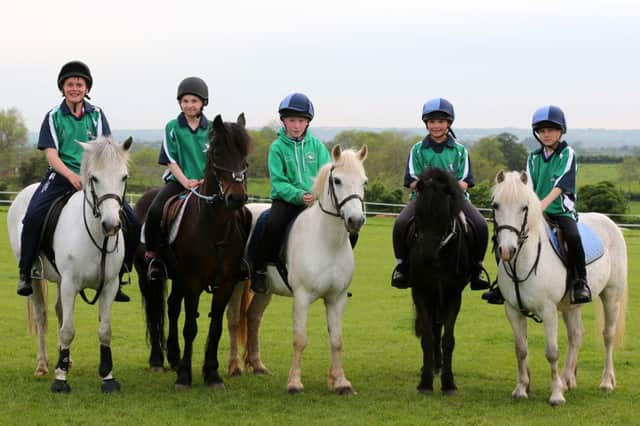 The Northern Ireland Under 12 MGA (Mounted Games Association) team who travel to Belgium in July for the European Championships are seen here at training last week in Ballymena. L-R, James McNabney, Brigid Delargy, Michael Doherty, Erin Dunseath and William Hamilton. INBT 23-178CS
