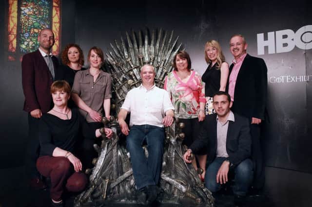 Tourism Ireland's  Game of Thrones Facebook Competition winners from Germany, France and GB with Mark Henry, Tourism Ireland (left) and Eimear Callaghan, Northern Ireland Tourist Board, (back row , second right) and Brian Twomey, Tourism Ireland (back row, right) amongst the artefacts at the Games of Thrones Exhibition in the Waterfront Hall, Belfast.inbm25-14