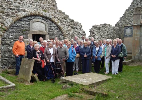Templepatrick Historical Society inside the ruins of the Templecorran church. INLT 25-642-CON