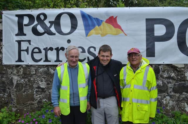 Pictured is Mount Druid Vintage Rally Event Organisers James Kirkpatrick, Rev Patrick Barton and Leslie Heaney at last Saturday's P&O Ferries sponsored Rally in Ballintoy. INBM25-14 12 RALLY 12S
